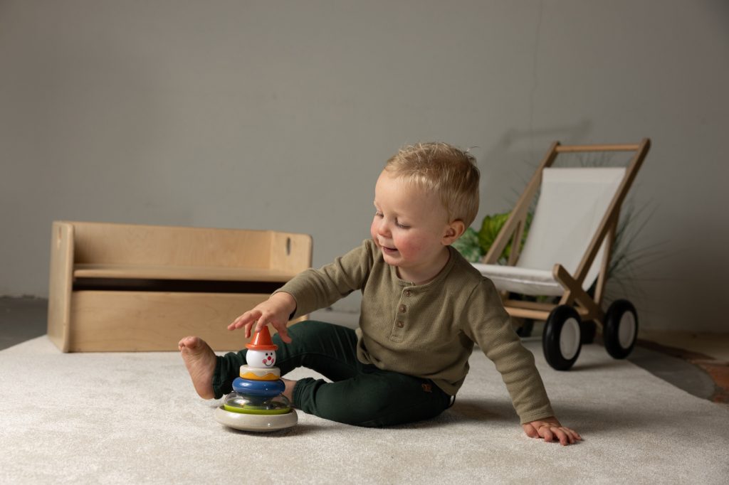 A child playing with a Tolo Classic toy